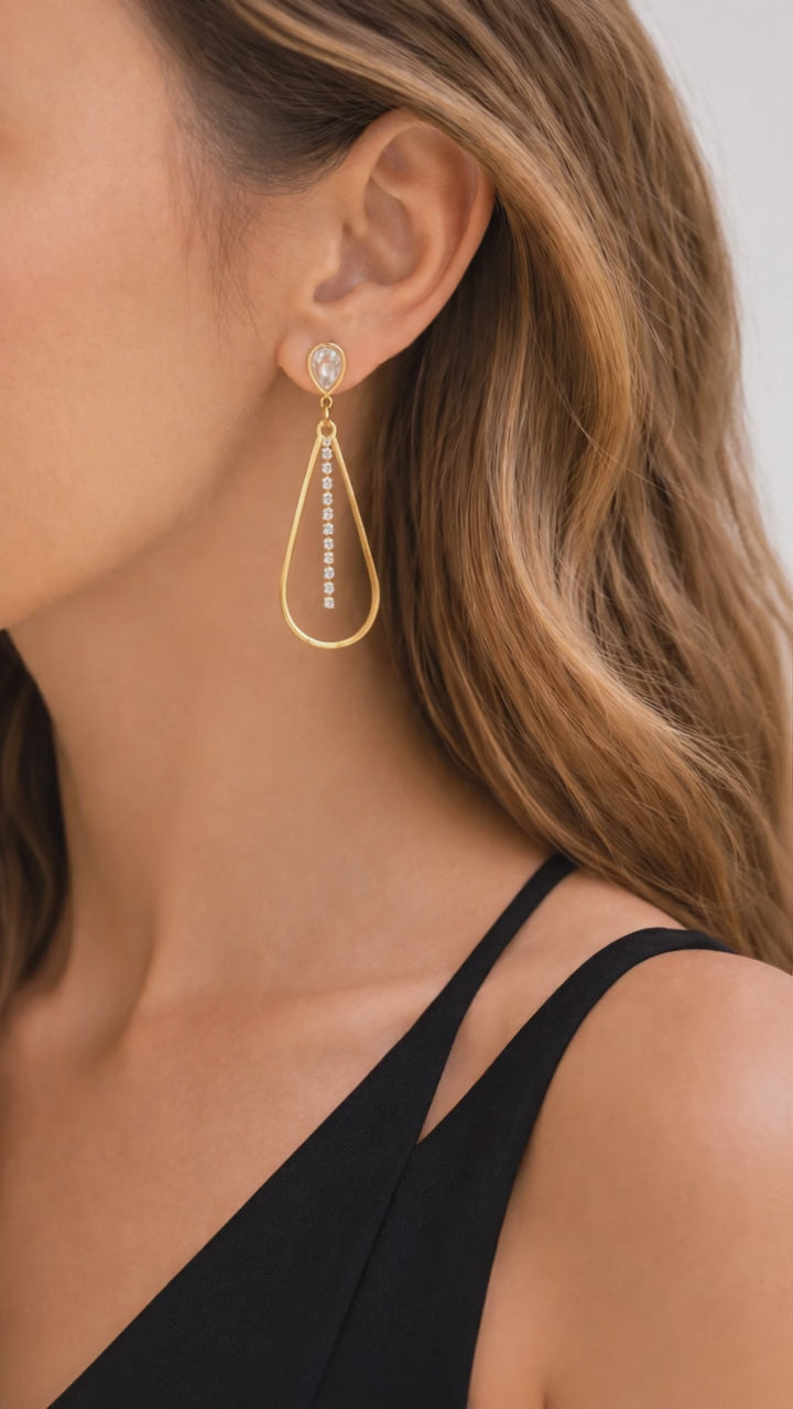 bold and beautiful woman showing dangler earrings 